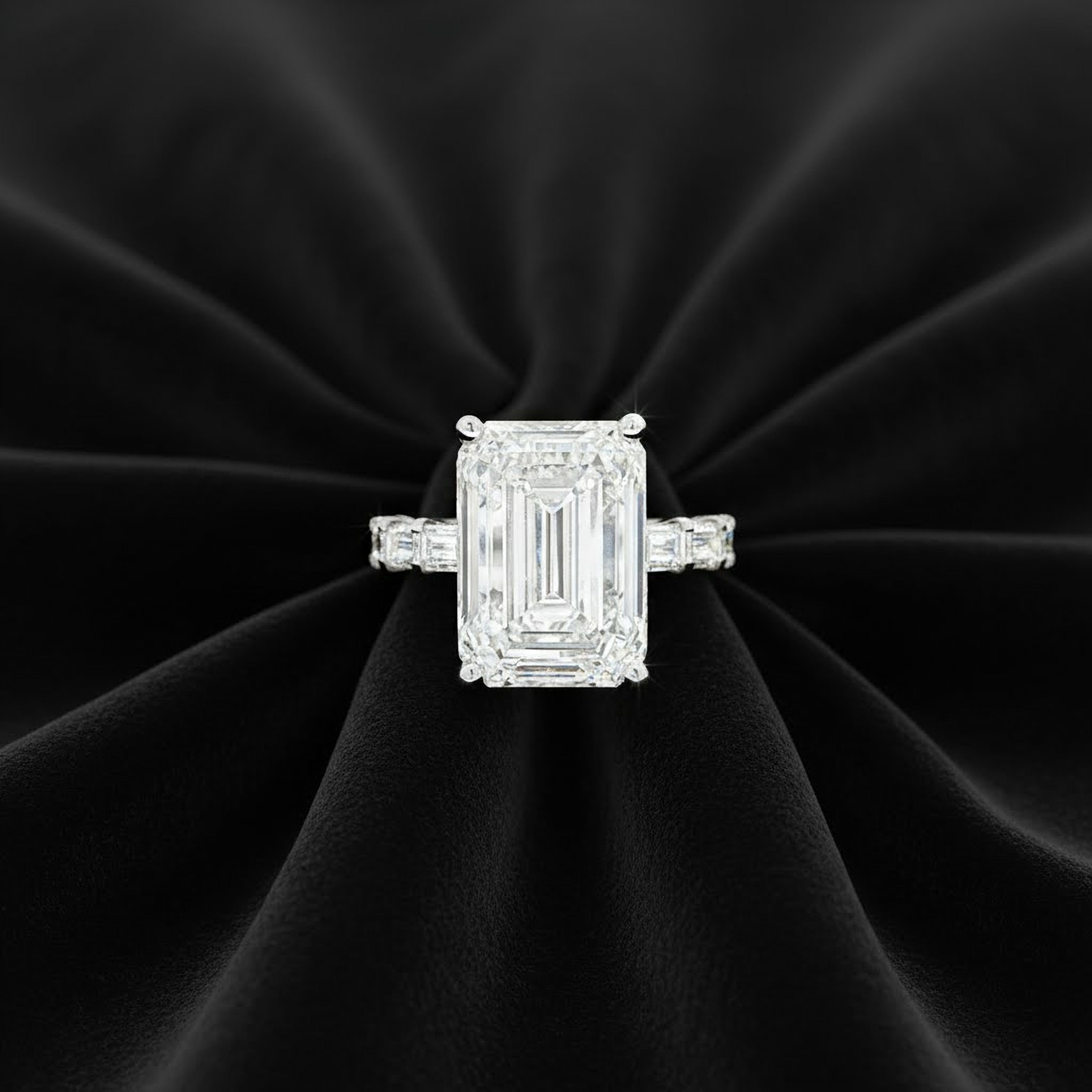 10ct Emerald Ring with Baguette Side Stones
