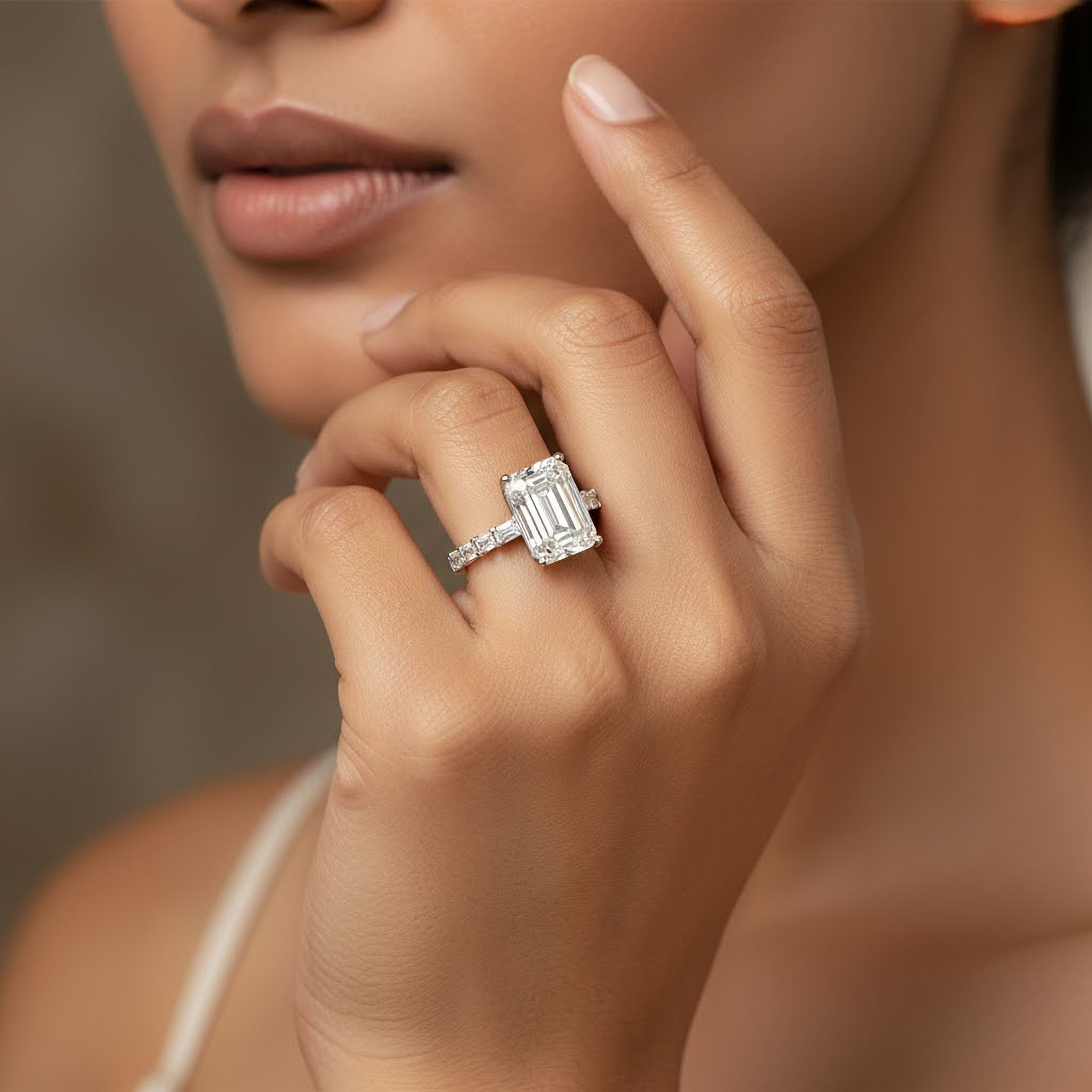 10ct Emerald Ring with Baguette Side Stones